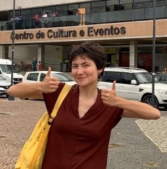 Student smiling with two thumbs up