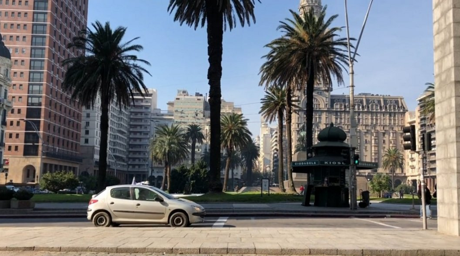 A street with a car driving past