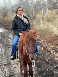 Student riding a horse