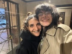 Two people posing closely for a photo