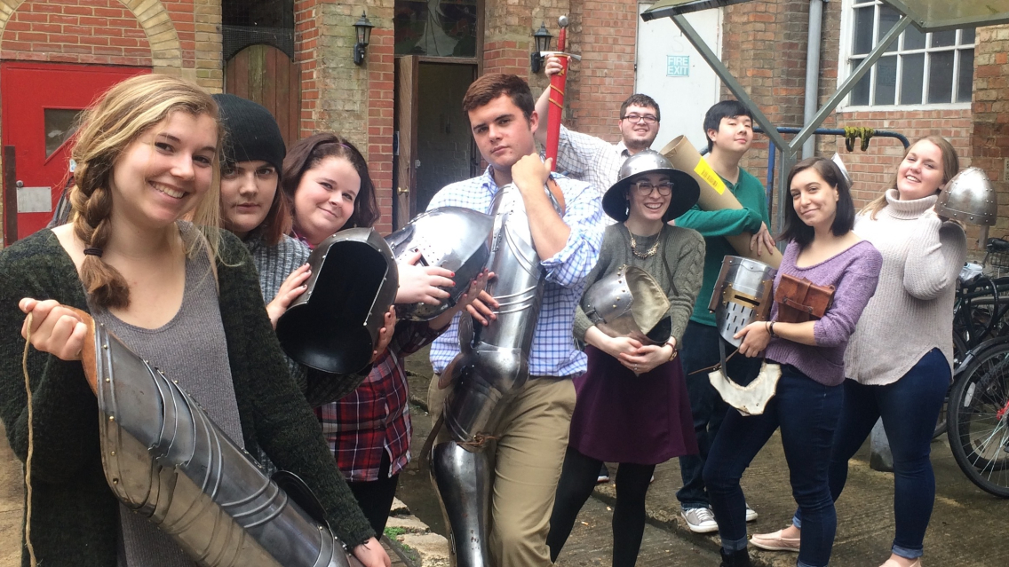 Students pose with various bits of armour.