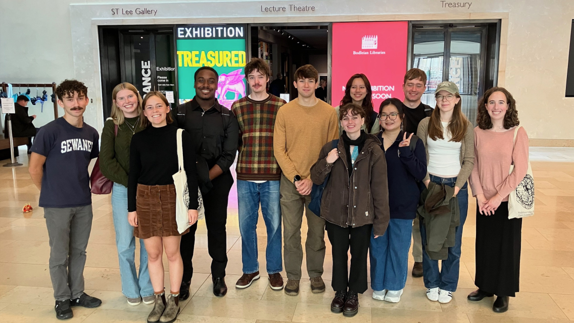 Students stand outside a museum exhibition at the Weston Library in Oxford.