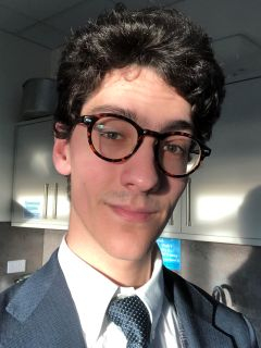 Student posing with glasses