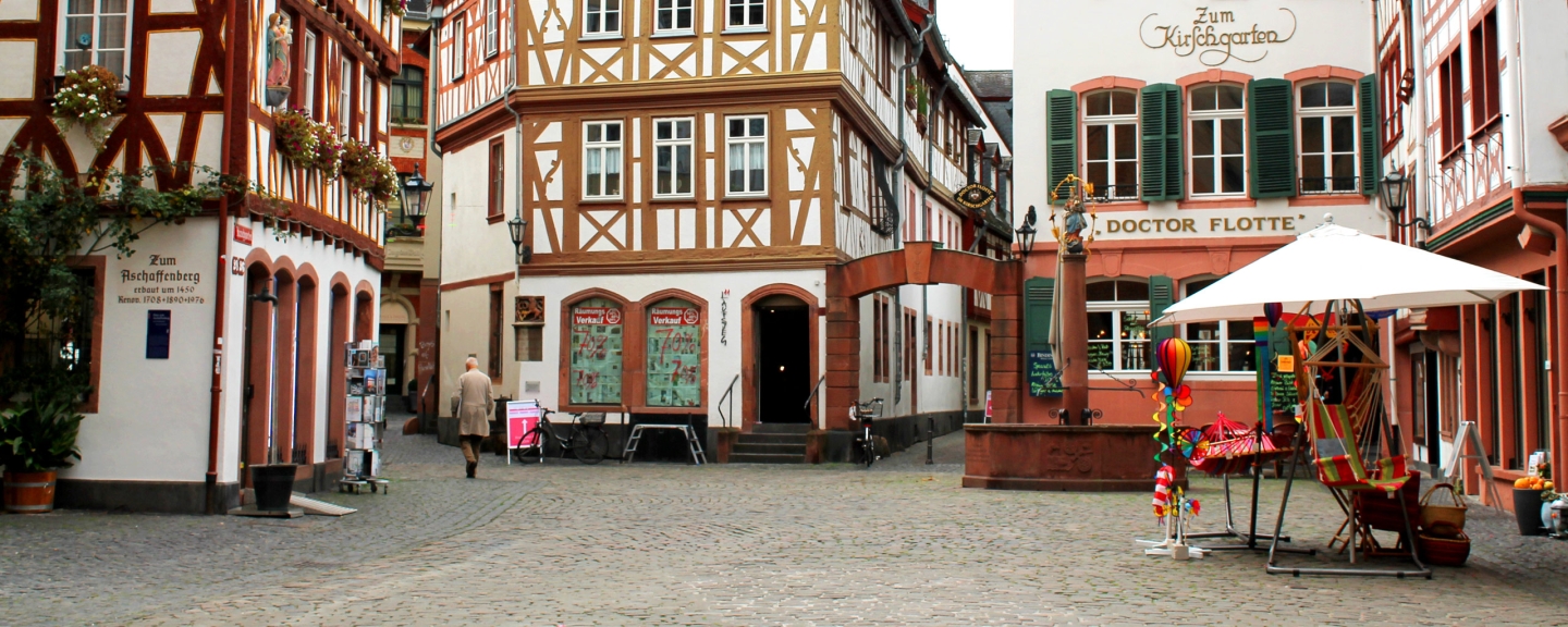 Village square, older gentleman walking