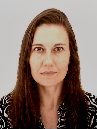 Professor with long dark hair and dark top