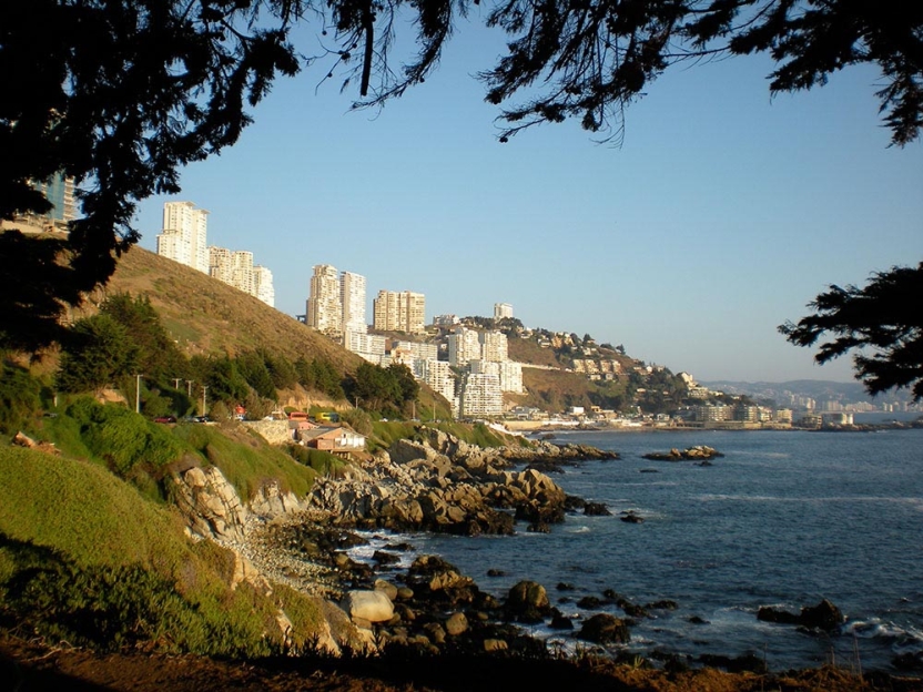 Oceanside city with rocky shore