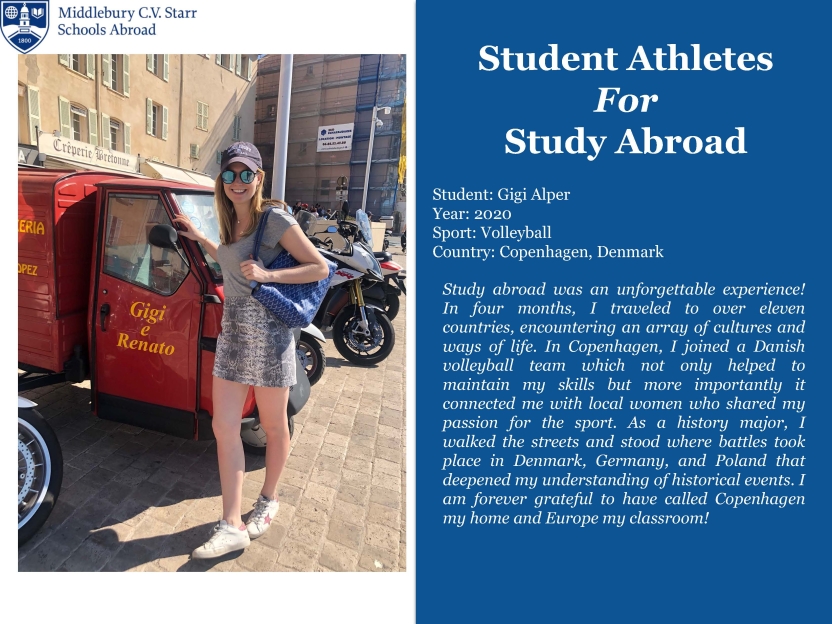 A student in a baseball cap and sunglasses leans against a motorbike in a European square smiling