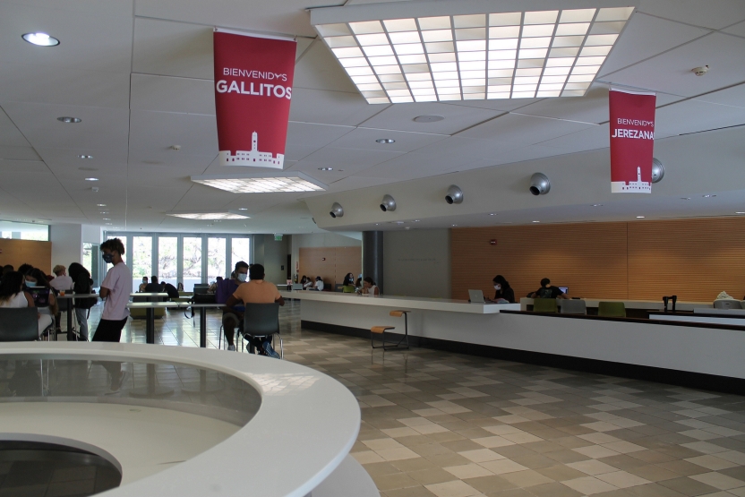 Inside the campus center, with students sitting at tables