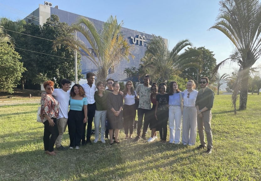 Students and faculty standing in front of the UFF campus in Brazil