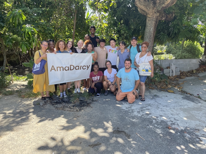 A group holding a banner reading "AmaDarcy"