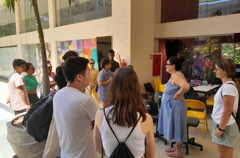 A woman presenting to a group of students