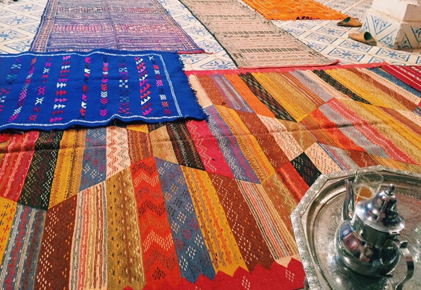 Colorful rugs displayed for sale
