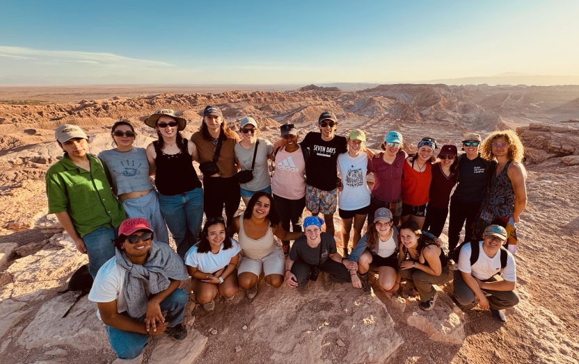 A group of students post in the Atacama Desert