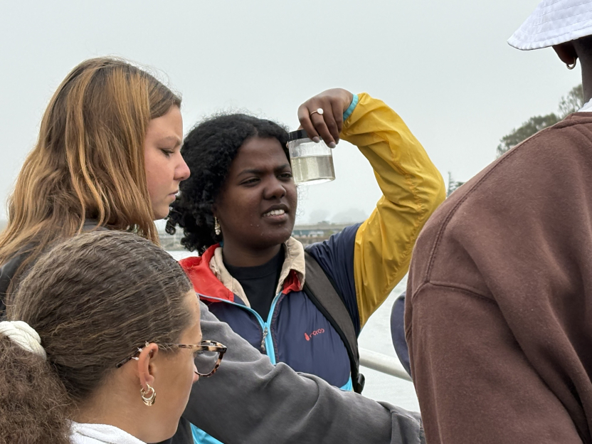 A student looks closely at a water sample