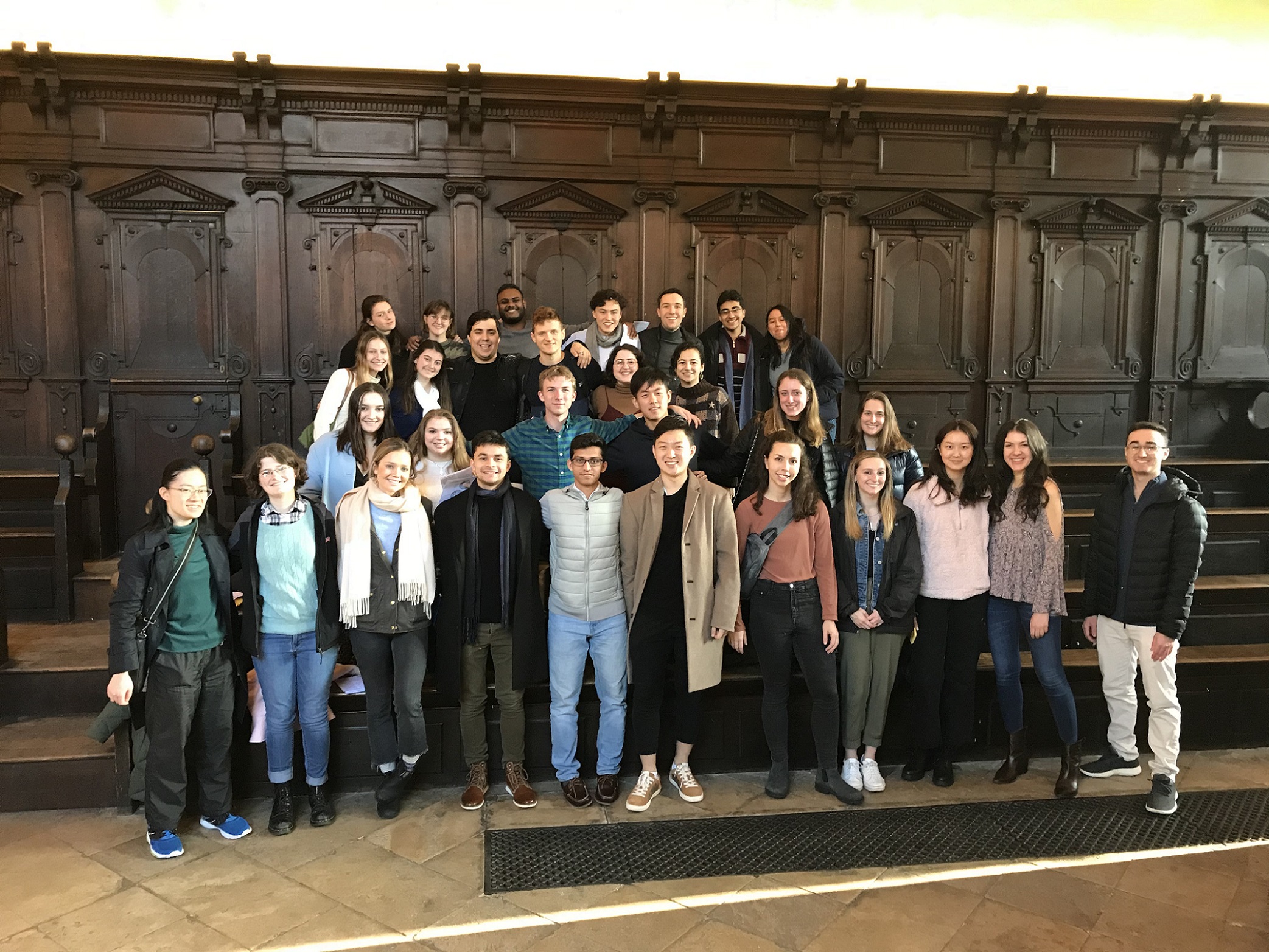 A group of students in a large library room