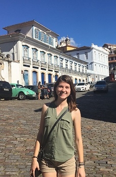 A student on a cobblestone street