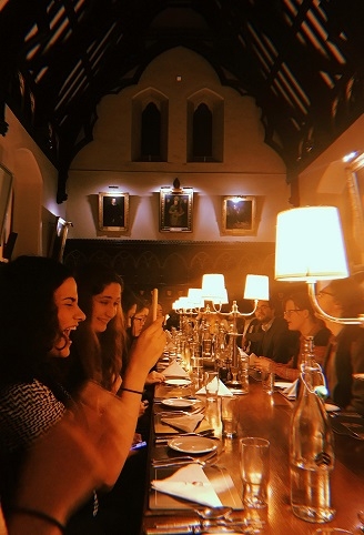 Happy students in the Keble College Dining Hall