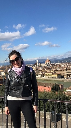 A student stands overlooking the city of Florence