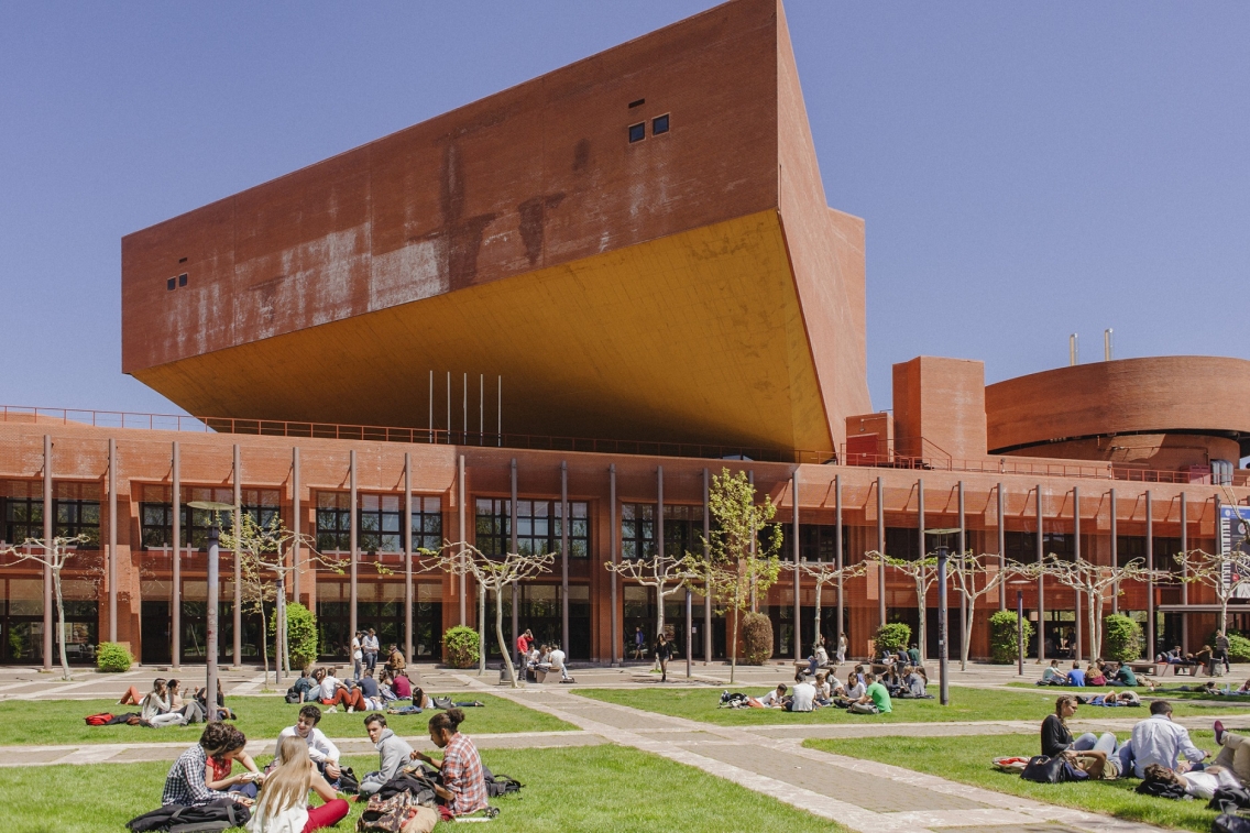 Students sitting in a quad on campus
