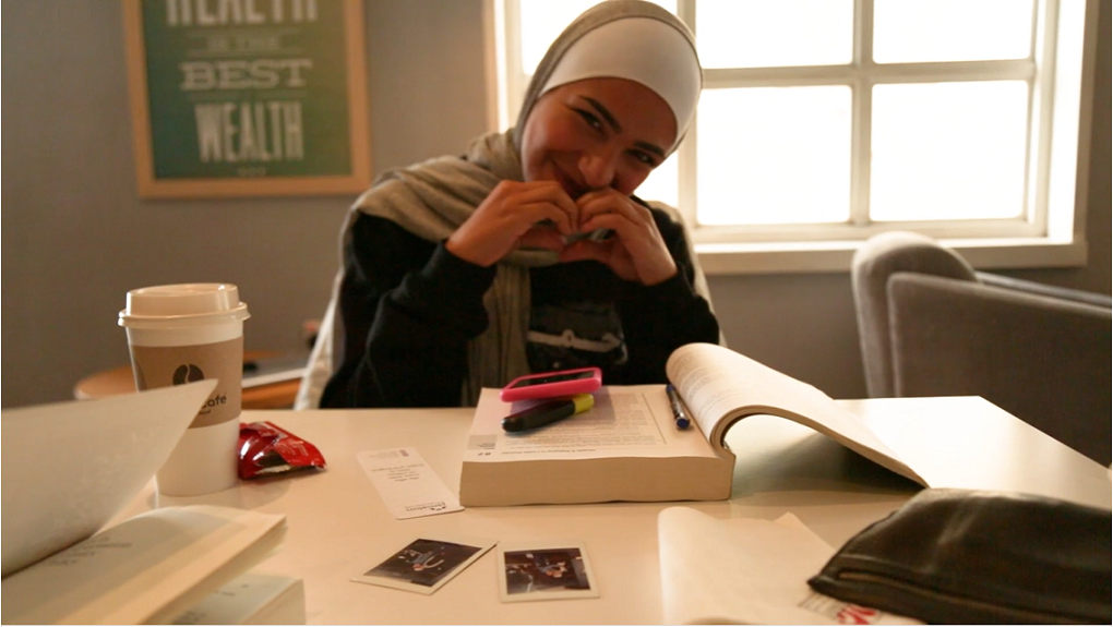 Jordanian student making a heart with her hands