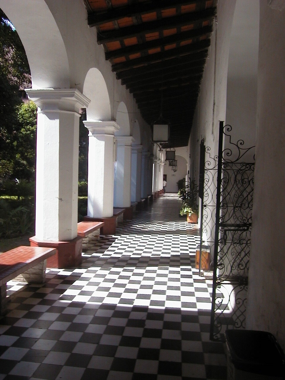 An outdoor corridor with archways