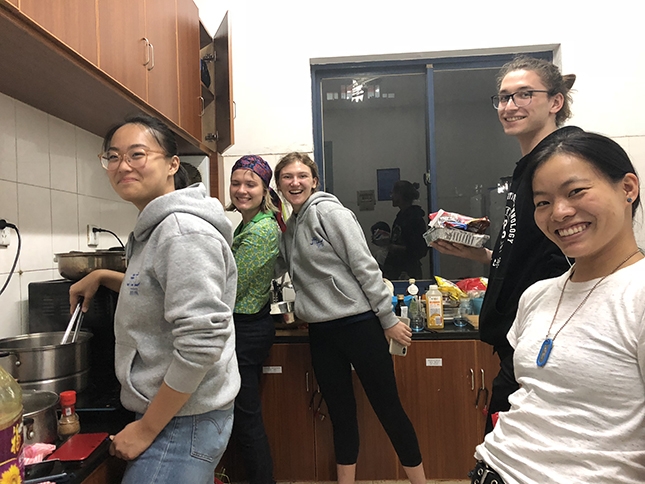 Photo of students preparing a meal in a communal kitchen in Hangzhou.