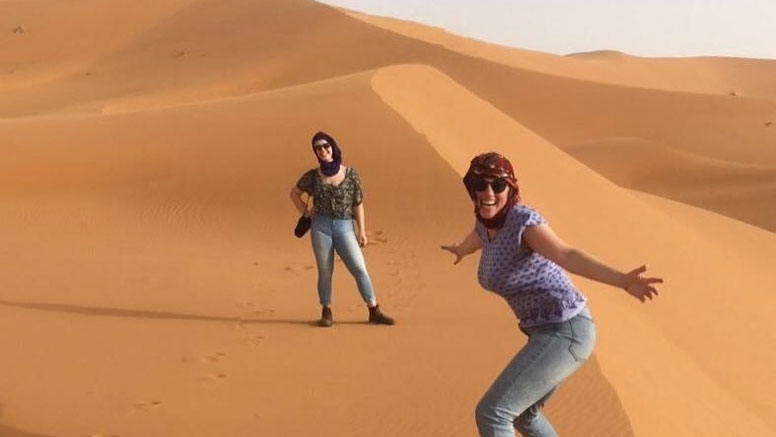 Students on the dunes of Morocco.