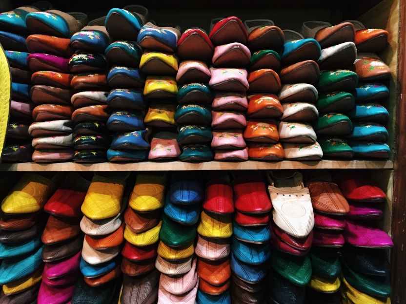 Colorful leather shoes stacked together