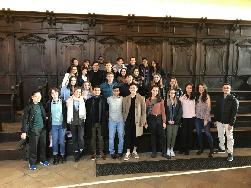 A group of students in a large library room