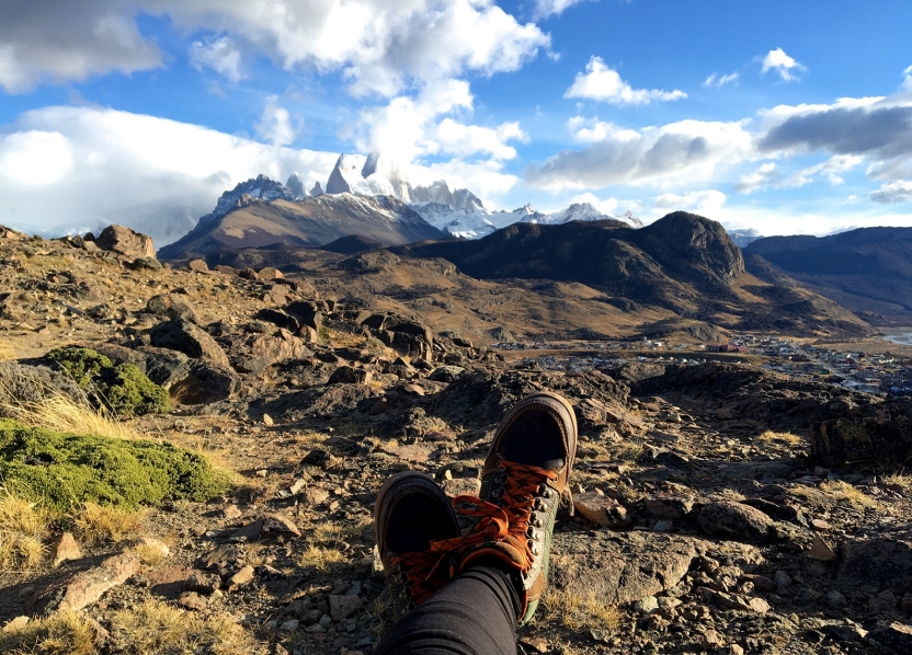 Hiking boots in front of a mountain in El Chalten, Argentina
