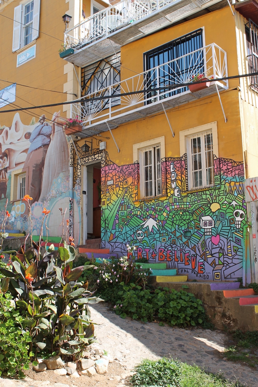 A colorful building with the words art + believe