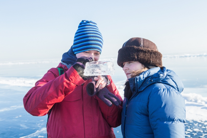 Students inspect a chunk of ice