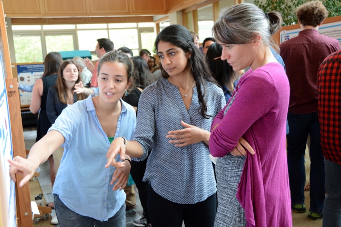 Neuroscience majors Deniz Bingul ’18 (left) and Kisha Kalra ’18 discuss their research with Molly Costanza-Robinson, associate professor of chemistry, biochemistry, and environmental studies.