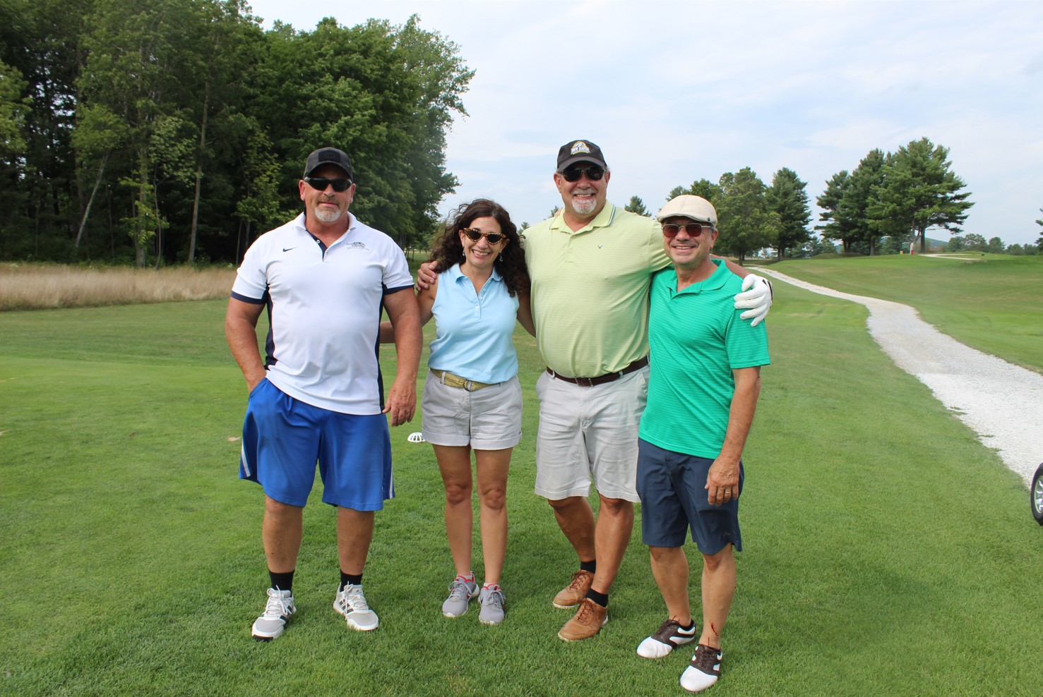team photo from employee golf tournament