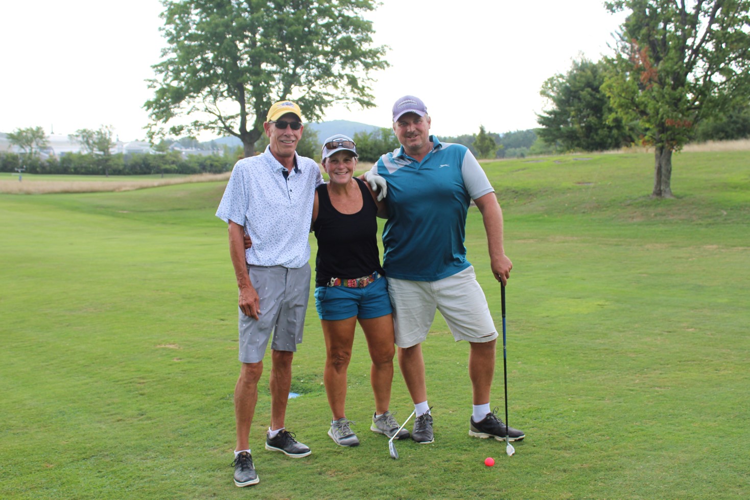 team photo from employee golf tournament