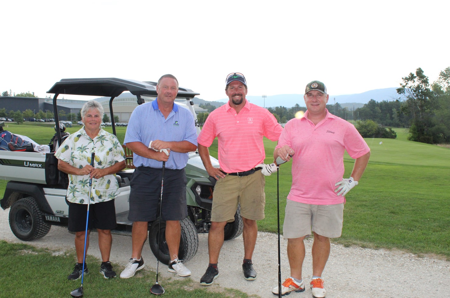 team photo from employee golf tournament