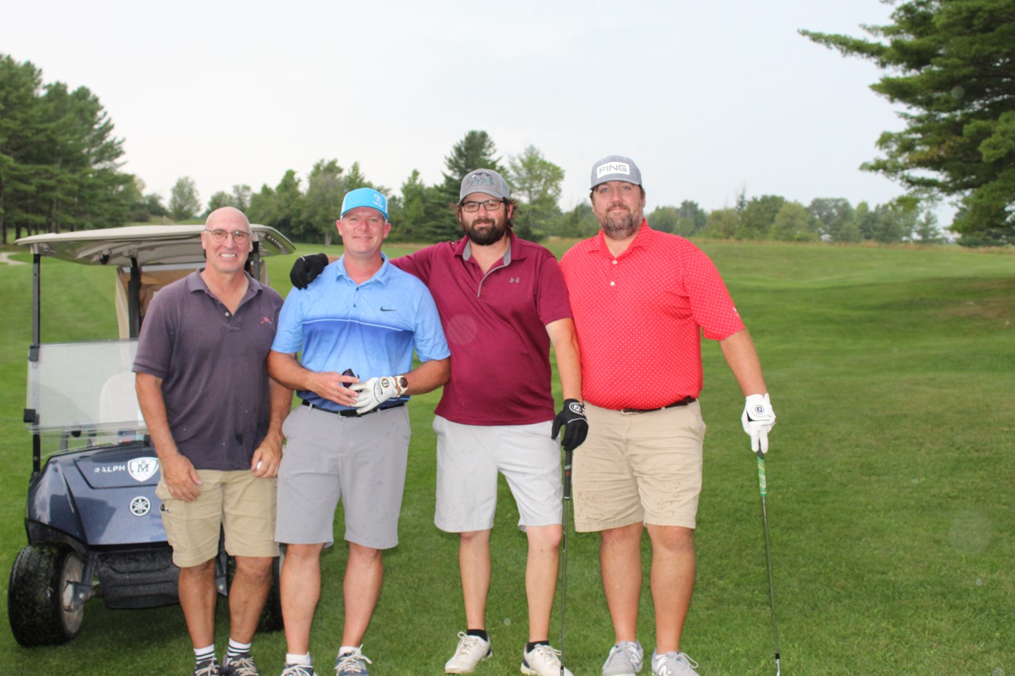 team photo from employee golf tournament
