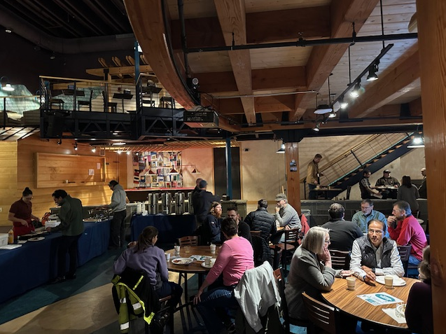 Photos of staff members eating pancakes