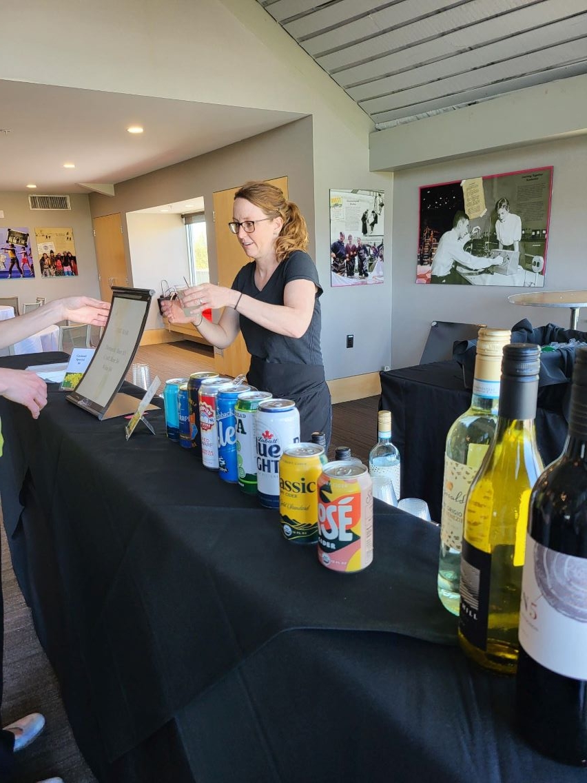 Bartender serving drink to customer