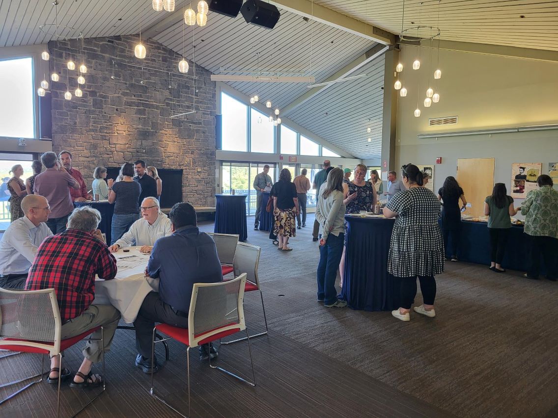 Room full of colleagues for a social gathering