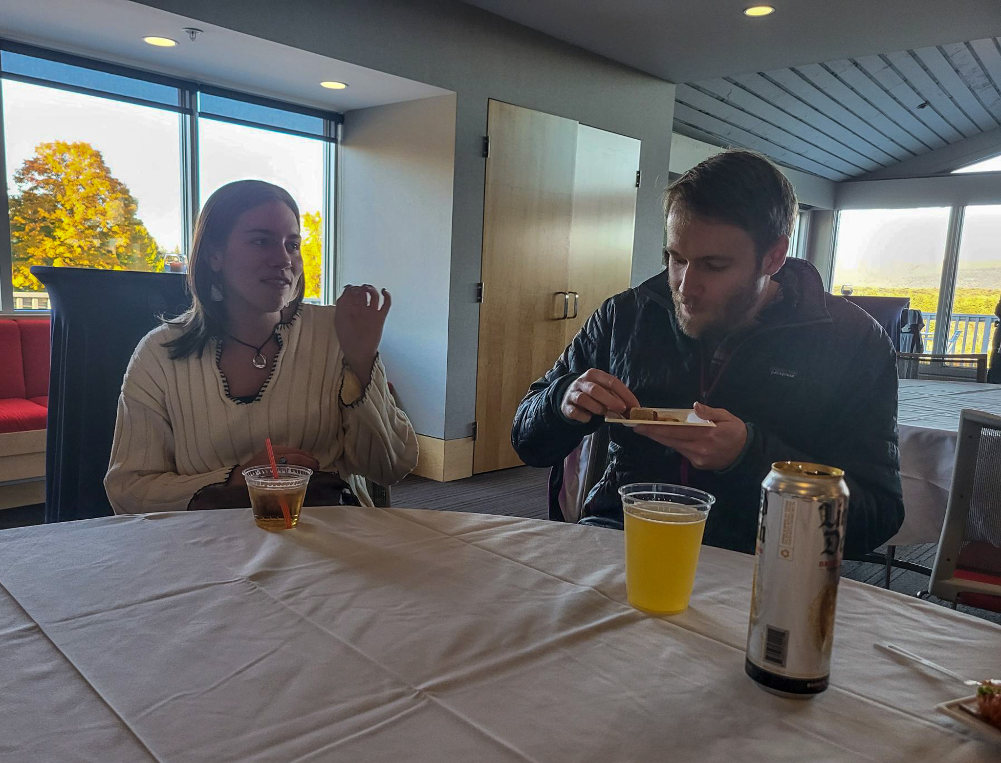 two colleagues sitting together talking