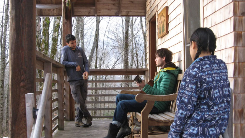 Students relaxing on the Burgin Lodge porch.