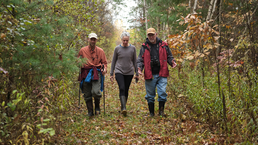 Faculty and staff walk the trails at the Trombulak Nature Sanctuary