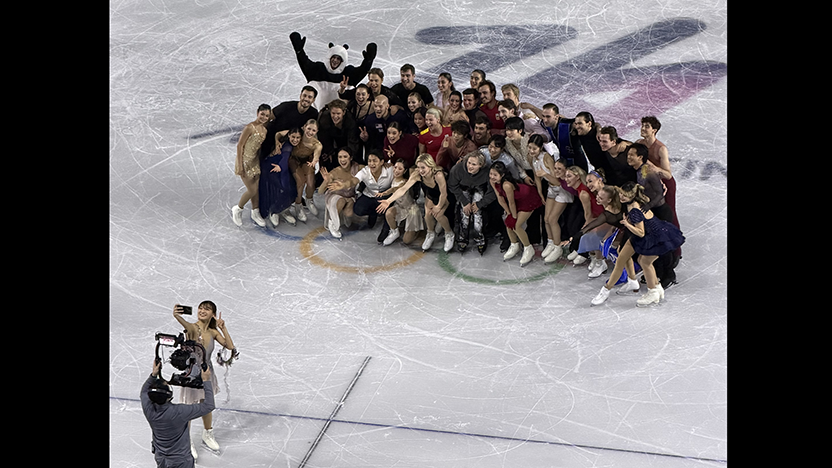 Skaters who performed in the Olympic gala pose for a group photo and selfies on the ice