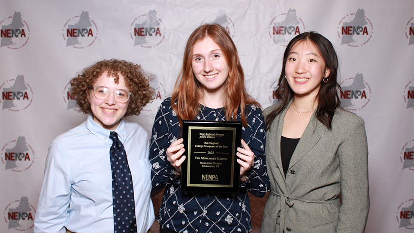 Former and current "Middlebury Campus" editors pose with their award plaque.