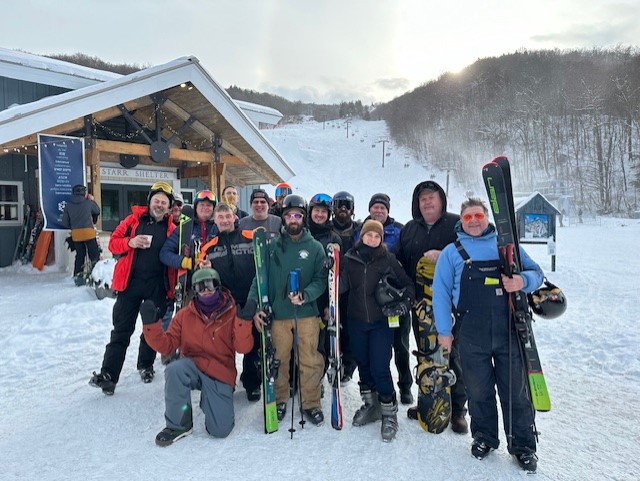 employees at snowbowl with ski gear