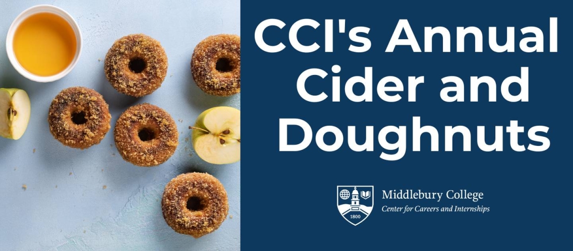 Photo od cider doughnuts covered in sugar with a mug of apple cider.