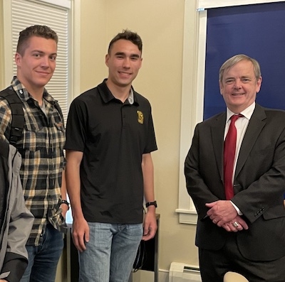 Two students and speaker