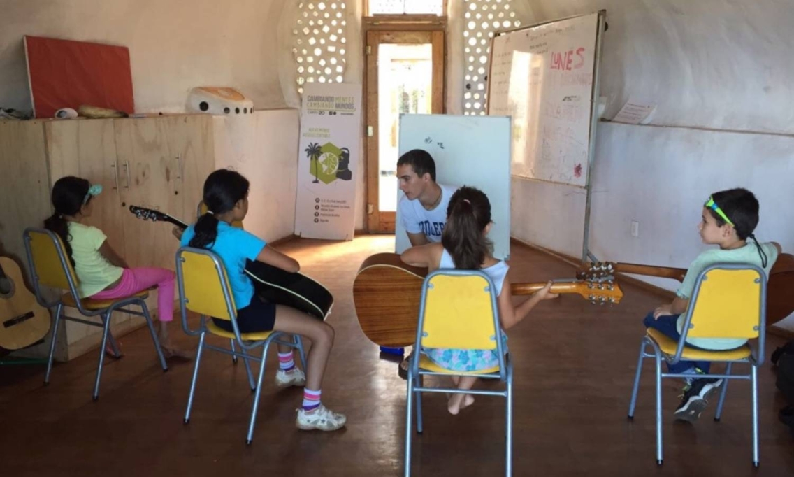 Mike Nunziante '19 teaches a guitar and theory class with a group of students at Toki School of Music and the Arts.