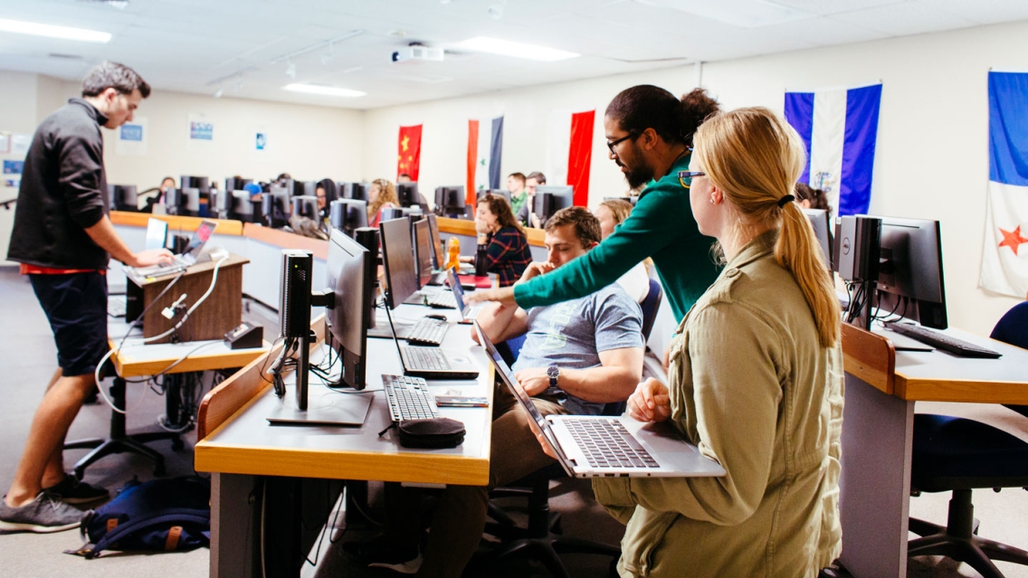 Students and faculty in a computer lab.